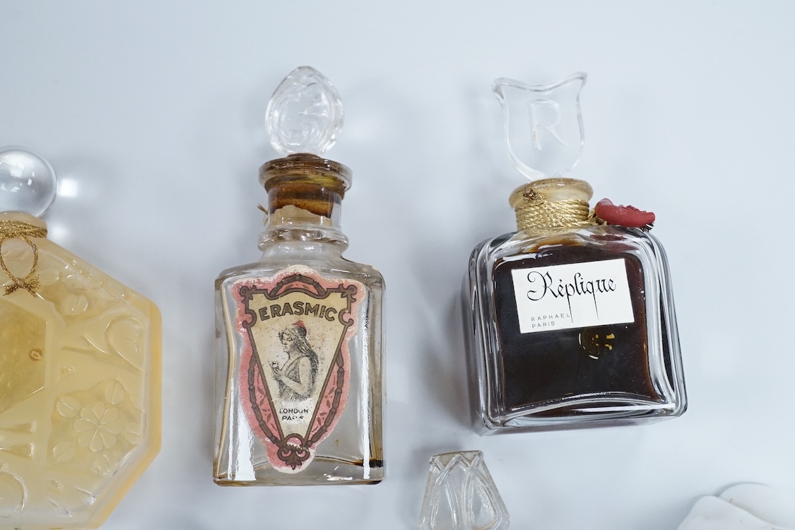 A Baccarat Guerlain perfume bottle in original box and a collection of other empty perfume bottles